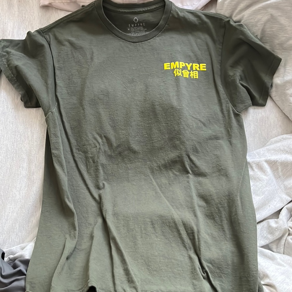 Green shirt, yellow font, Empyre Tee. Size Medium